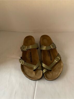 Birkenstock Mayari sandals in a metallic gold or olive
